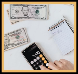 Photograph of a calculator and some money to illustrate the purpose of the Money Manager project